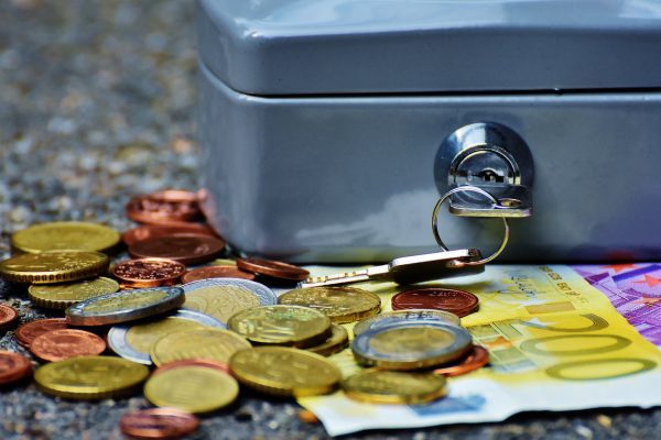 Banknotes and Coins Beside Gray Safety Box